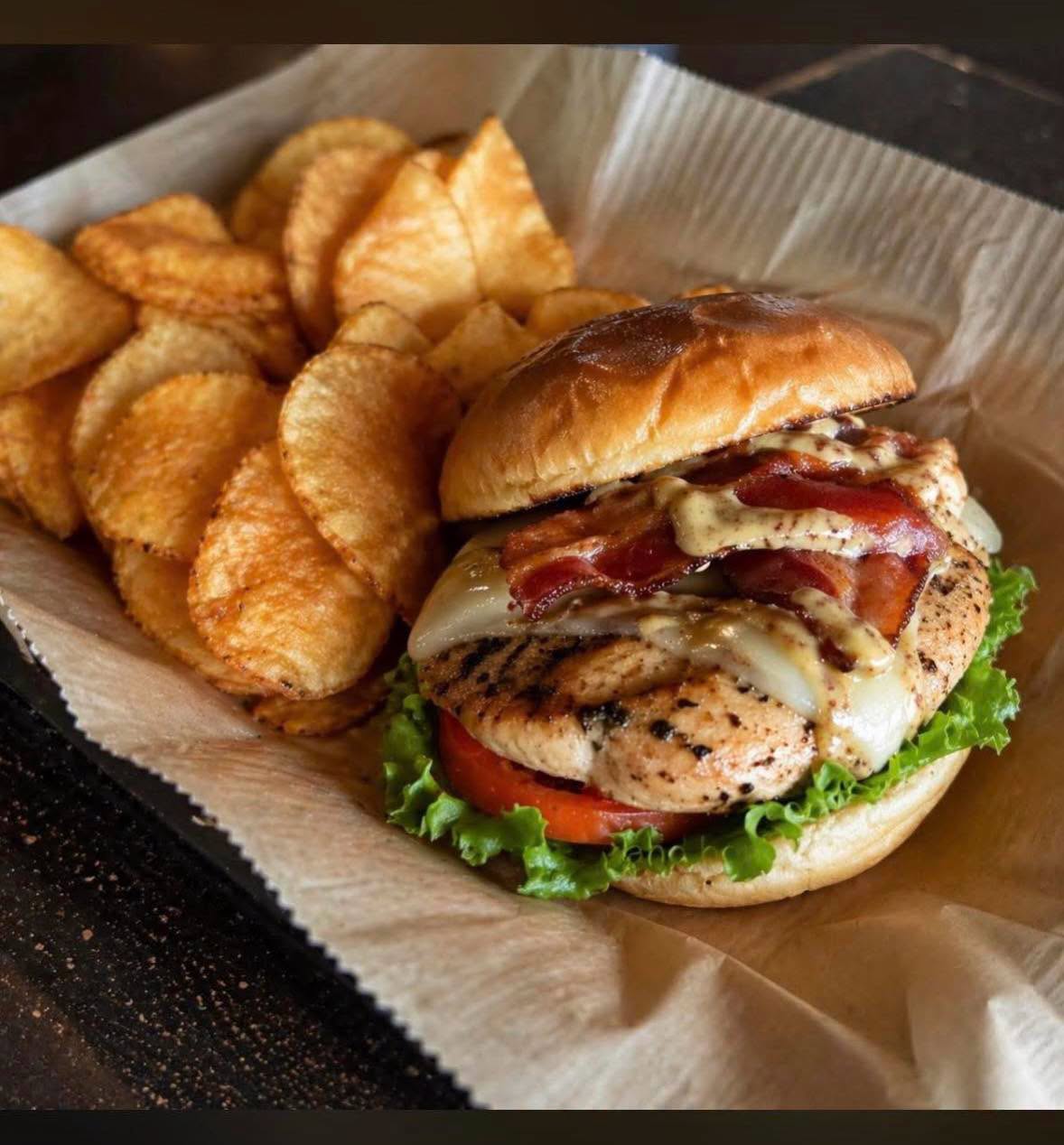 Grilled chicken bacon sandwich with kettle chips at The Silo
