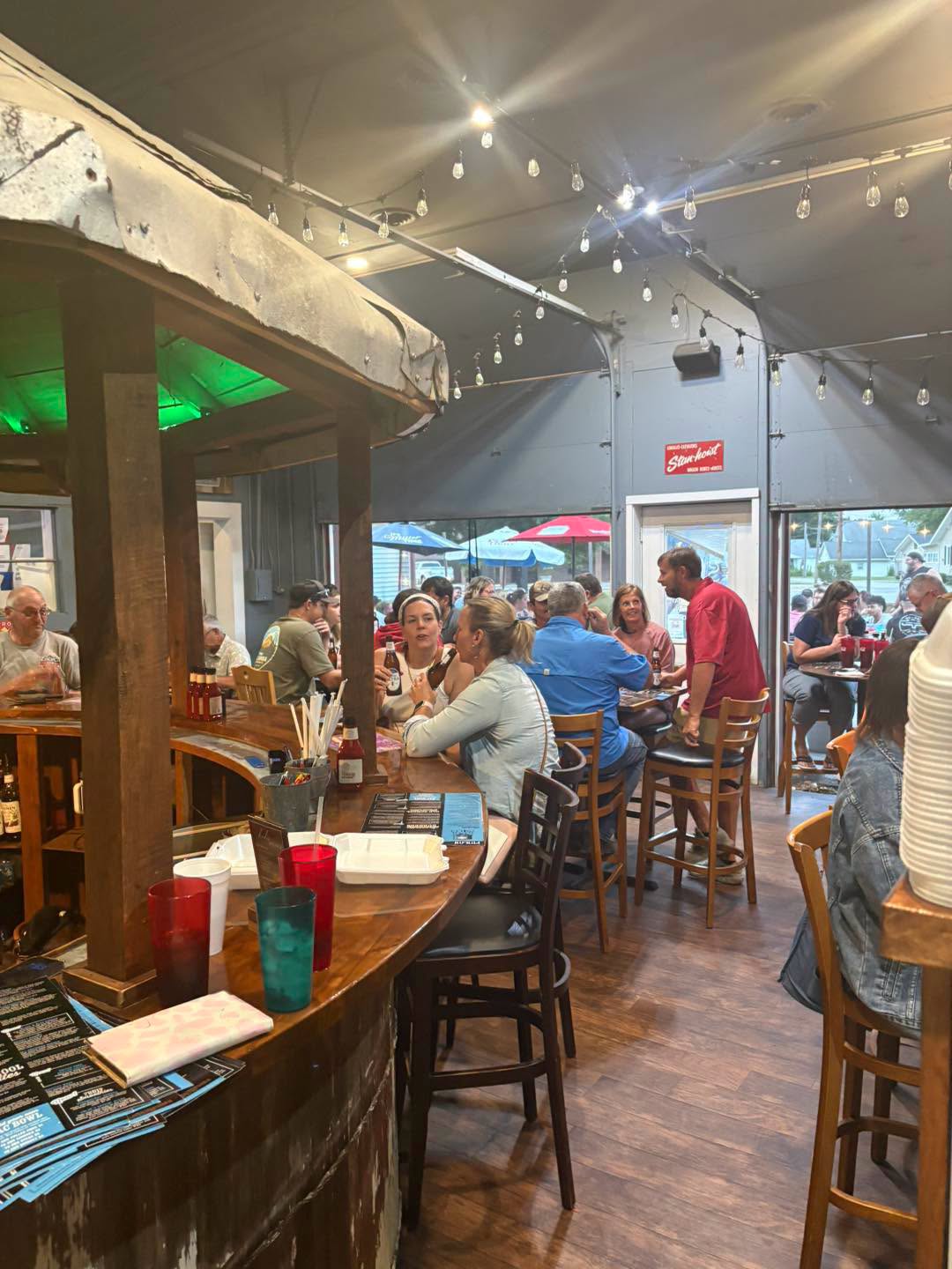 A full house at The Silo bar under string lights